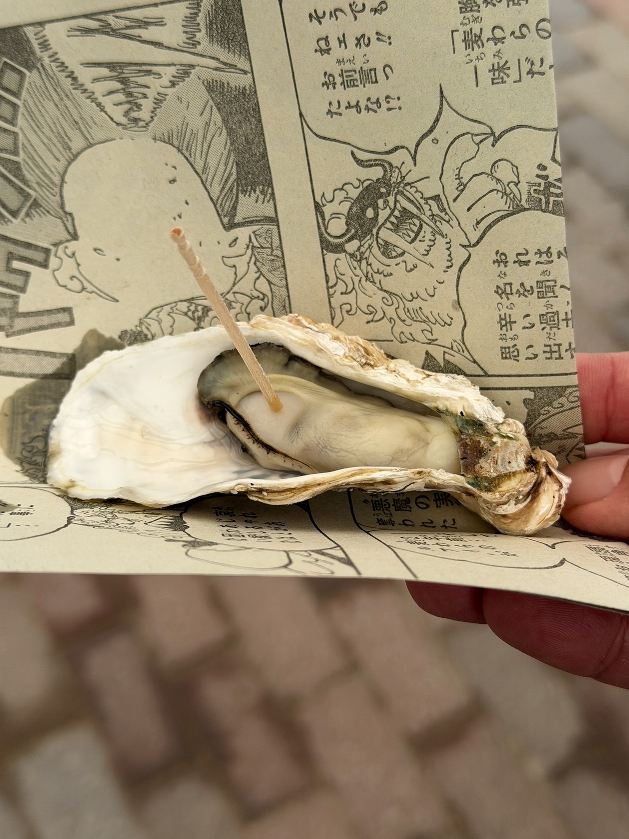 ランナーおもてなしの焼き牡蠣をもらって食べる